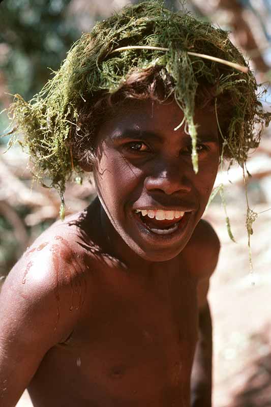 Boy with weeds