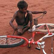 Fixing his bike