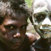 Tiwi boys with clay