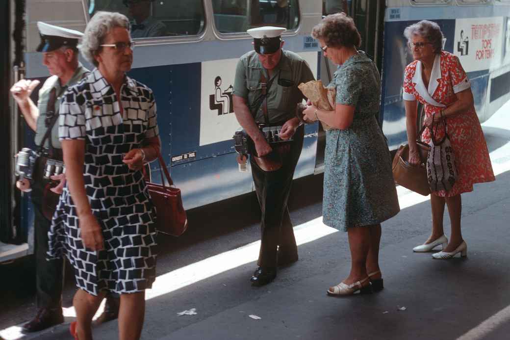 Conductor selling tickets