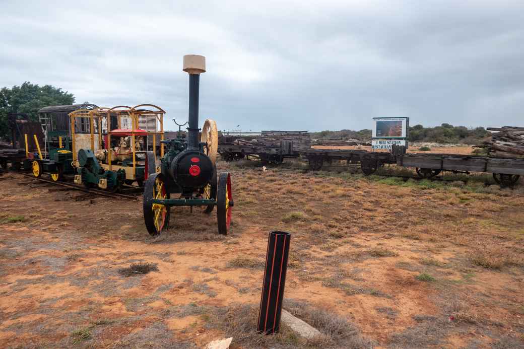 Old steam tractor and railway carriages