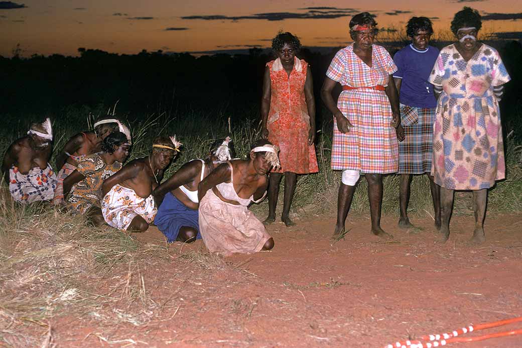 Women dance at dusk