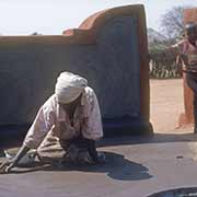 Woman polishing floor, Mahalapye