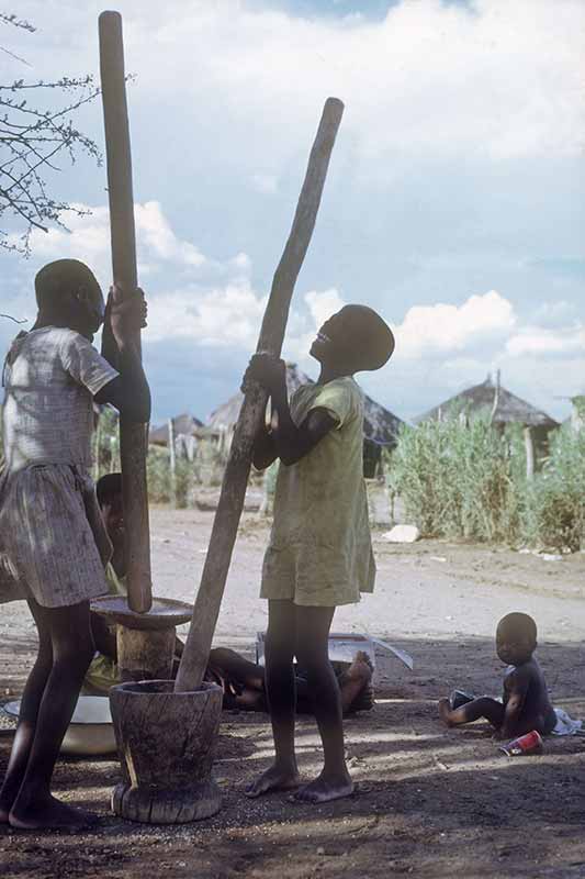 Girls pounding maize, Francistown