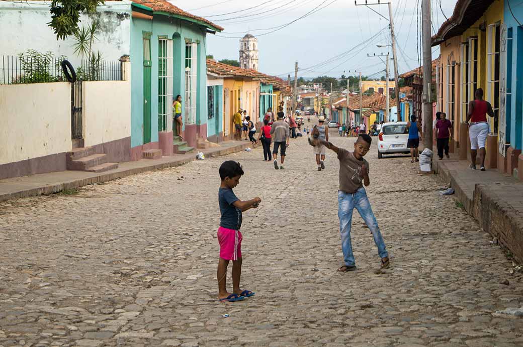 Boys playing tops, Trinidad