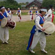 Women beating drums