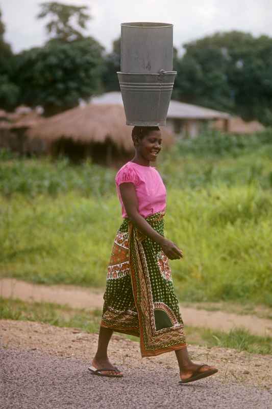 Woman carrying bucket