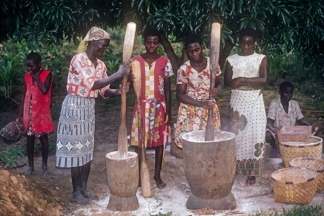 Women pounding cassava