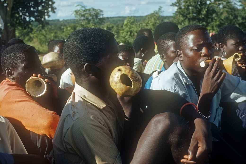 Boys playing on calabashes