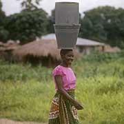 Woman carrying bucket