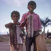 Boys selling shell necklaces