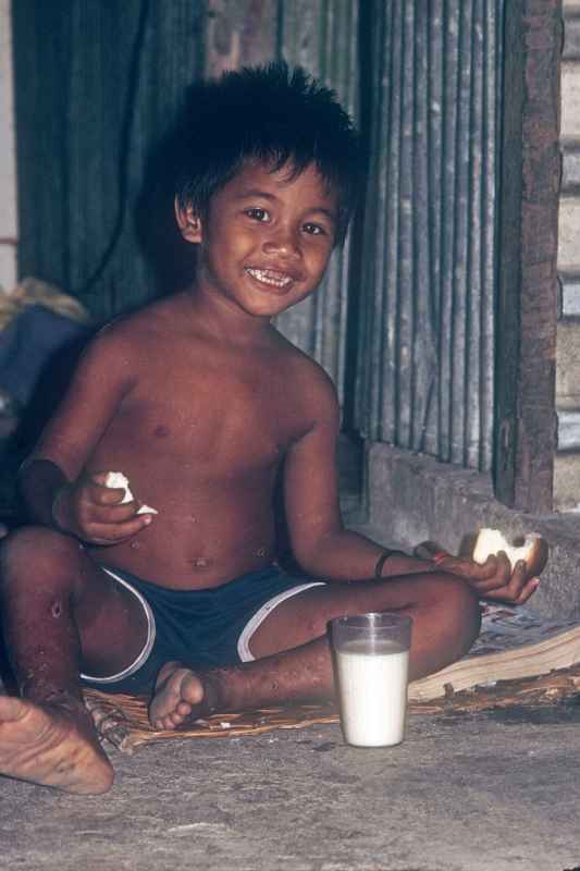 Boy eating bread