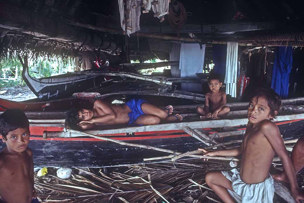 Boys in canoe house