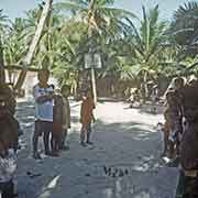 Chidren playing with tin cans