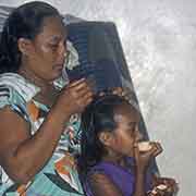 Mersina combing Ruth's hair