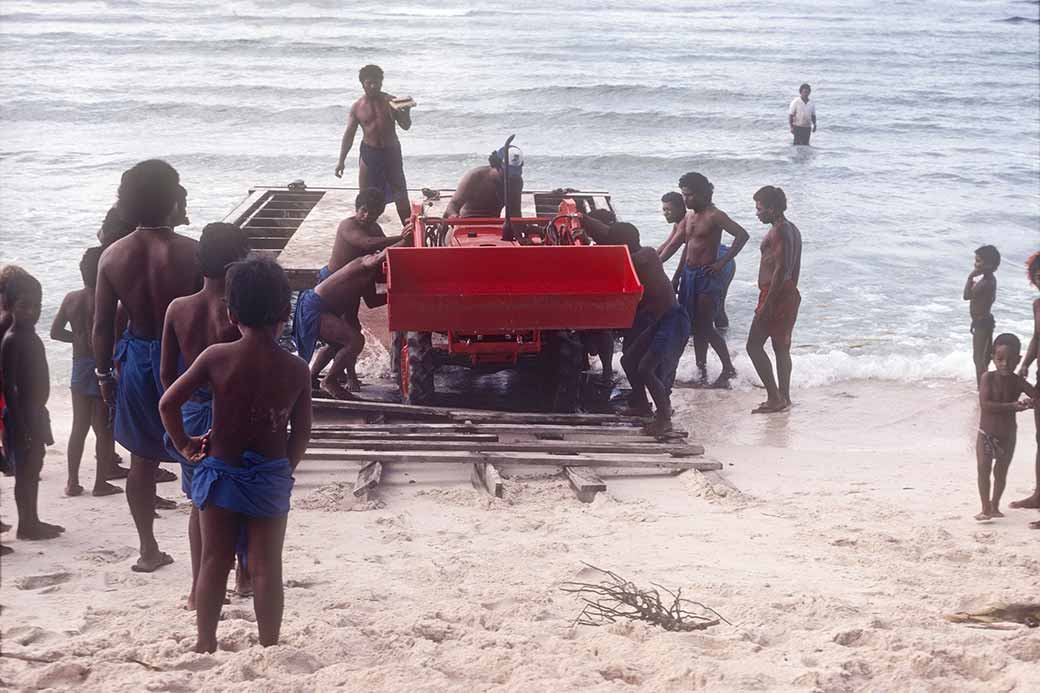 Driving tractor onto the beach