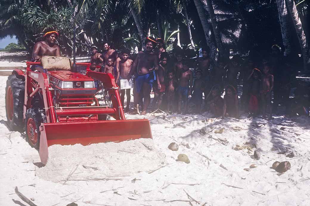 Demonstrating shovelling sand