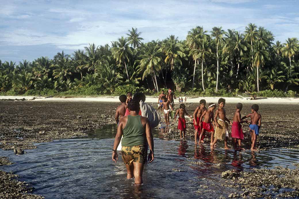 Wading ashore, Eauripik Atoll