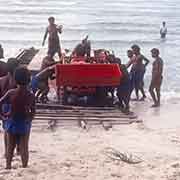 Driving tractor onto the beach