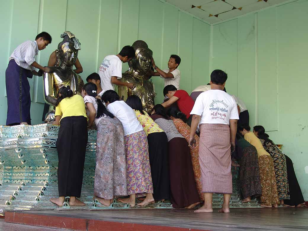 Polishing brass statues