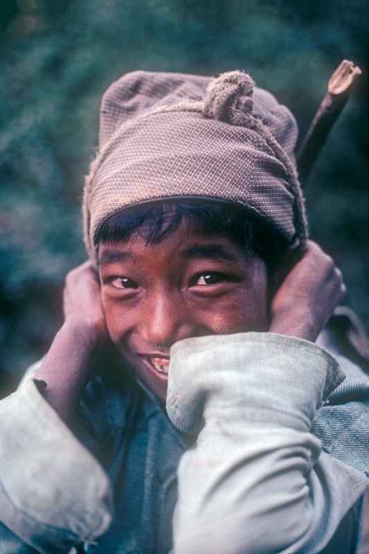 Boy carrying a load