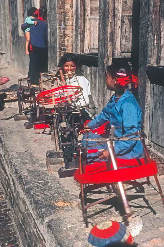 Girls spinning wool