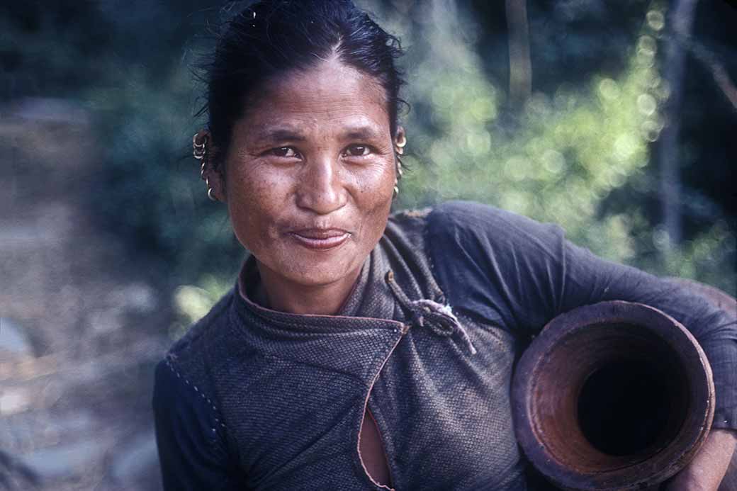 Woman carrying a jar