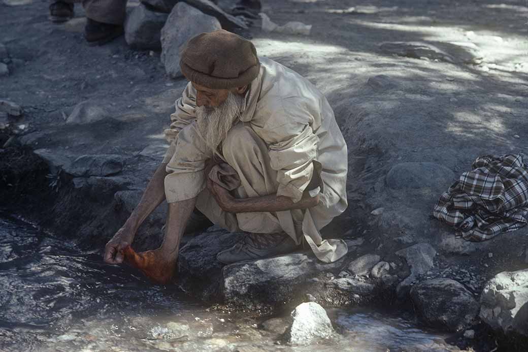 Washing his feet