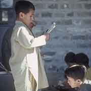 Boy reading in the school