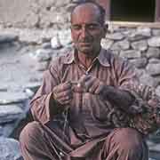 Man spinning wool