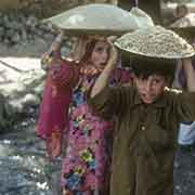 Children carrying rice