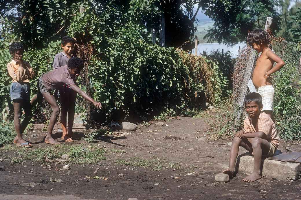 Boys playing marbles