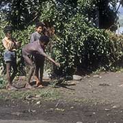 Boys playing marbles