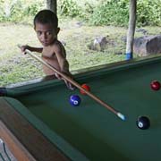 Boy playing pool