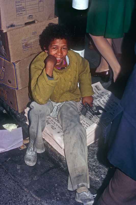 Boy selling newspapers