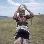 Young Mpondo woman with bottle