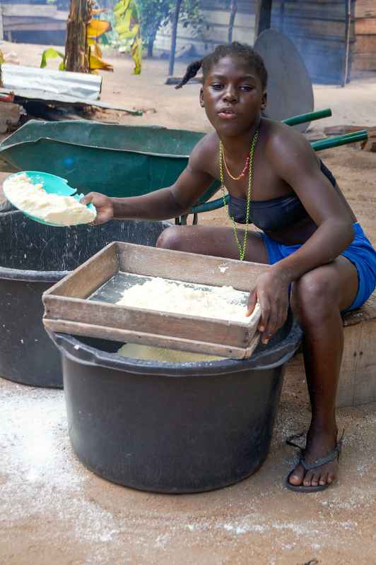 Sifting manioc flour, Malinka