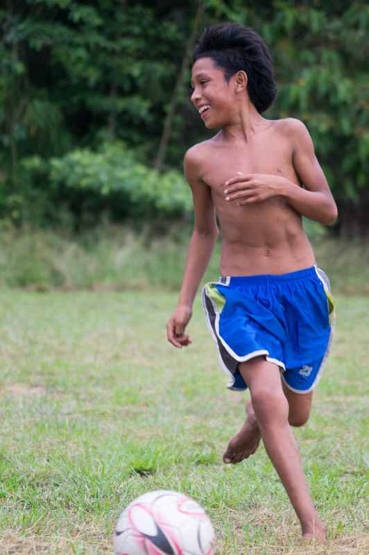 Boys playing football, Palumeu