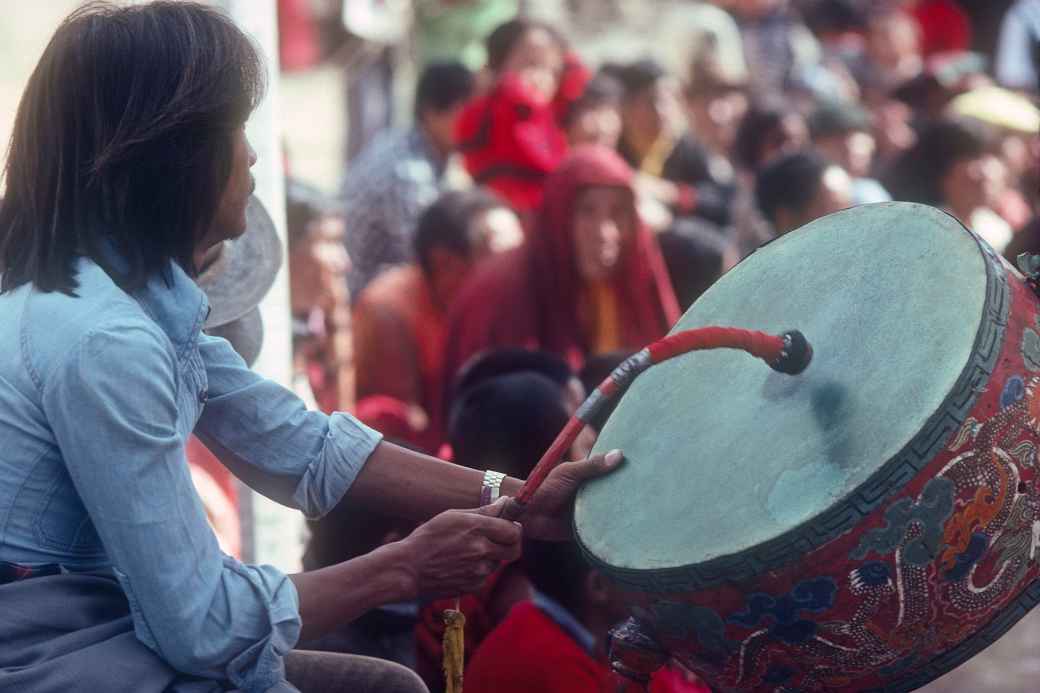 Playing the 'Dhyangro' drum