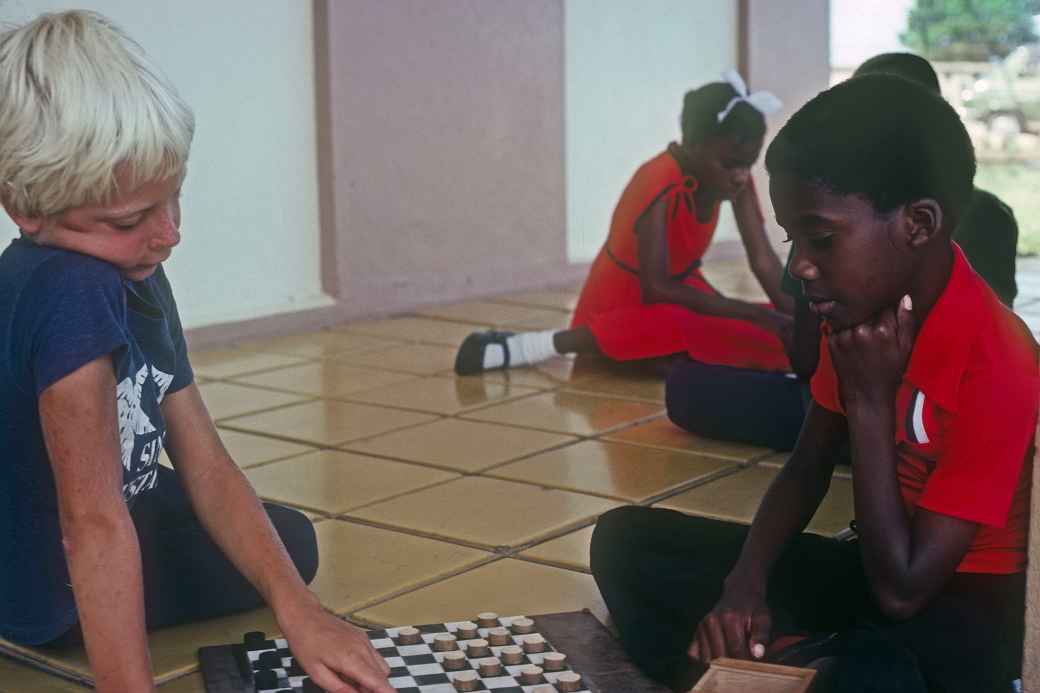 Boys playing checkers