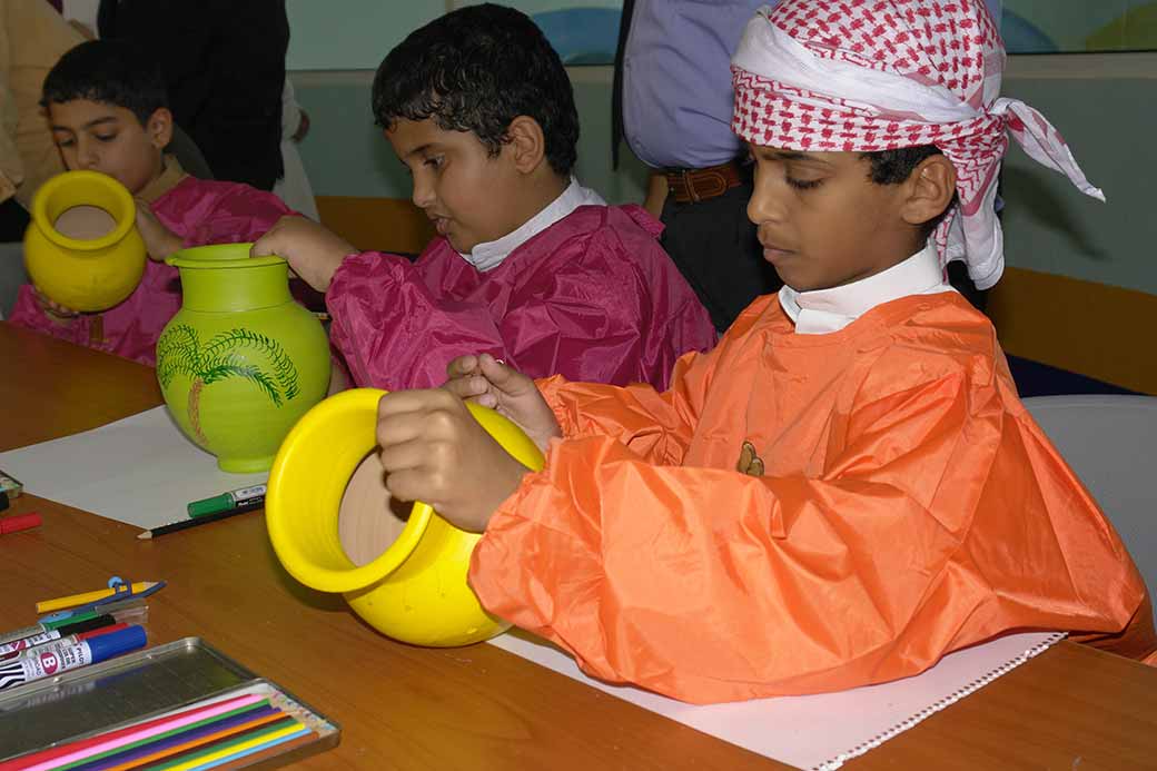 Boys with clay pots